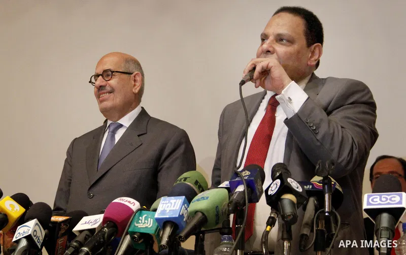 Egyptian Nobel Peace Prize winner and former head of the International Atomic Energy Agency, Mohamed ElBaradei addresses a press conference with novelist Alaa al-Aswany and other personalities, at the Egyptian Press Synd...
