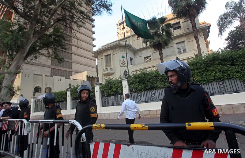 Egyptian security forces stand guard outside the Saudi Embassy in Cairo, Egypt during a demonstration to demand the release of an Egyptian human rights lawyer detained in Saudi Arabia for allegedly insulting the kingdom'...