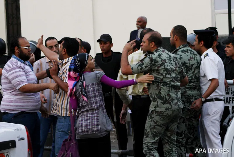An Egyptian Army officer argues with protesters demonstrating in front of the Saudi Embassy in Cairo, Egypt to demand the release of an Egyptian human rights lawyer detained in Saudi Arabia for allegedly insulting the ki...