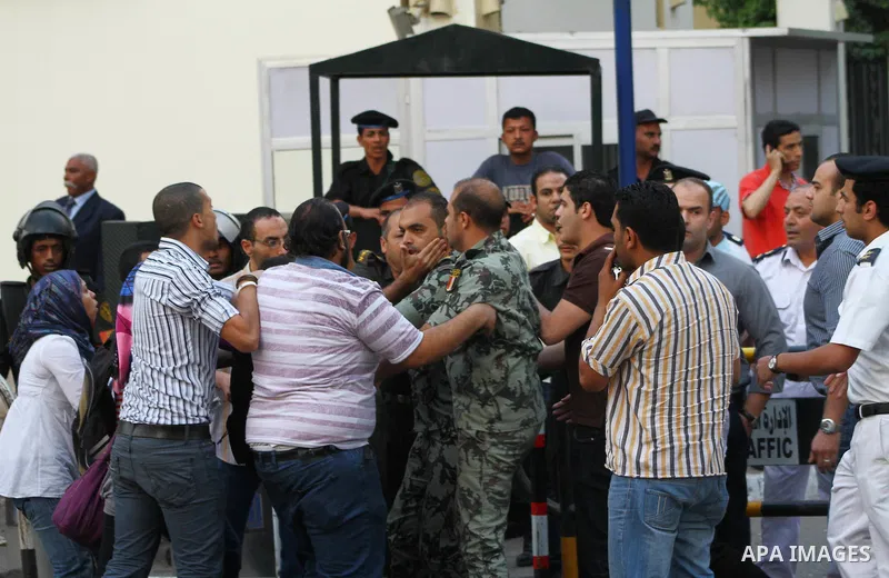 An Egyptian Army officer argues with protesters demonstrating in front of the Saudi Embassy in Cairo, Egypt to demand the release of an Egyptian human rights lawyer detained in Saudi Arabia for allegedly insulting the ki...