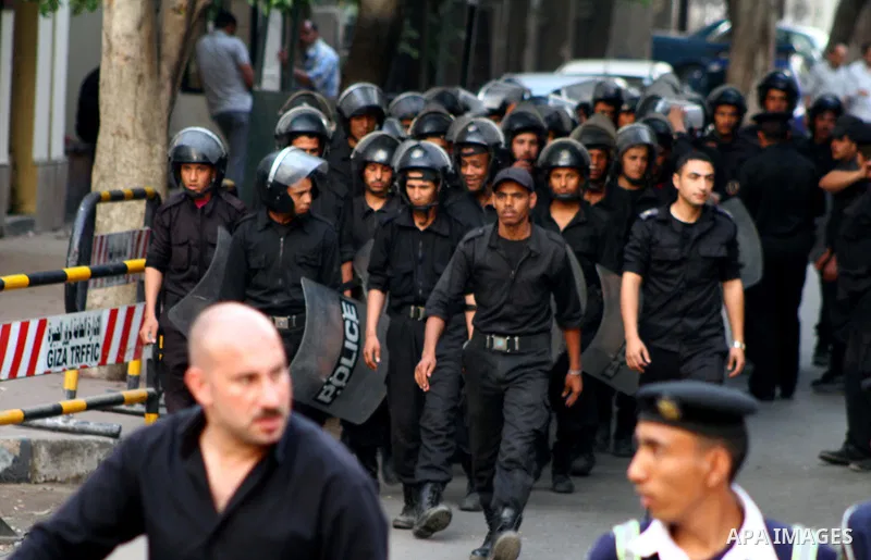 Egyptian security forces stand guard outside the Saudi Embassy in Cairo, Egypt during a demonstration to demand the release of an Egyptian human rights lawyer detained in Saudi Arabia for allegedly insulting the kingdom'...