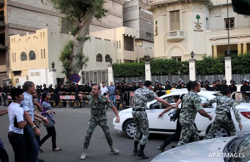 Egyptian security forces detain protesters demonstrating outside the Saudi embassy in Cairo on April 28, 2012. Saudi Arabia has decided to recall its ambassador to Cairo and close diplomatic missions in Egypt after prote...