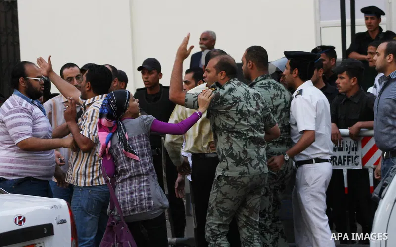 An Egyptian Army officer argues with protesters demonstrating in front of the Saudi Embassy in Cairo, Egypt to demand the release of an Egyptian human rights lawyer detained in Saudi Arabia for allegedly insulting the ki...