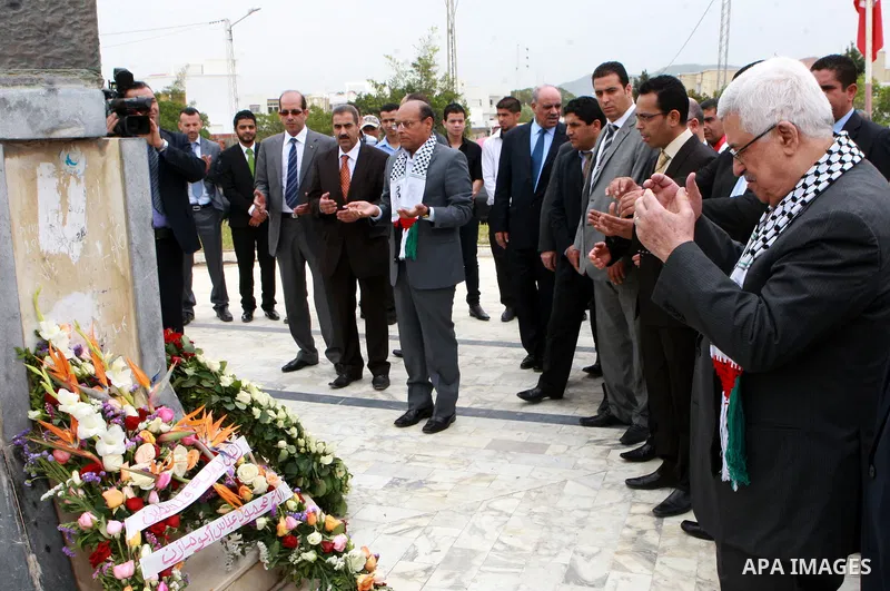 Palestinian President, Mahmoud Abbas (Abu Mazen), lays a wreath of flowers at the memorial to the martyrs of the Israeli raid in the hamam Al shat of Tunisia, in Tunis, on April 29, 2012. Photo by Thaer Ganaim