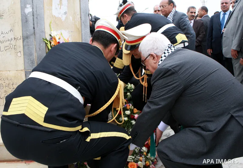 Palestinian President, Mahmoud Abbas (Abu Mazen), lays a wreath of flowers at the memorial to the martyrs of the Israeli raid in the hamam Al shat of Tunisia, in Tunis, on April 29, 2012. Photo by Thaer Ganaim