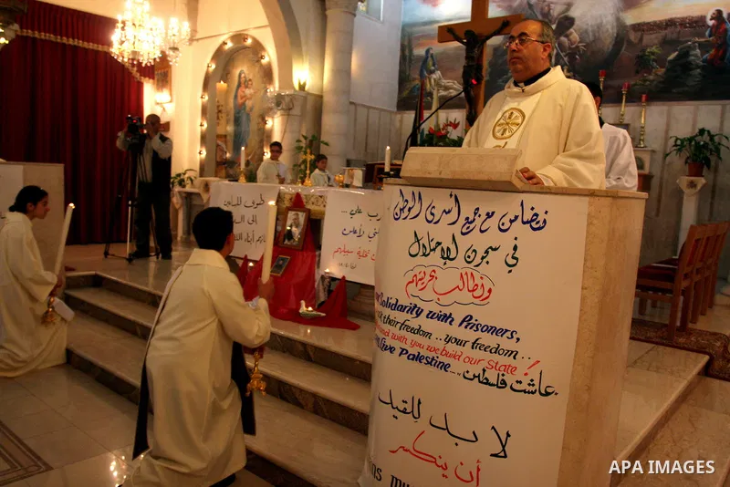 Palestinian Christians attend a special service in support of jailed Palestinians on hunger strike in Israeli prisons at a church in the West Bank city of Ramallah on April 29, 2012. Over the past week, Over 1,350 Palest...