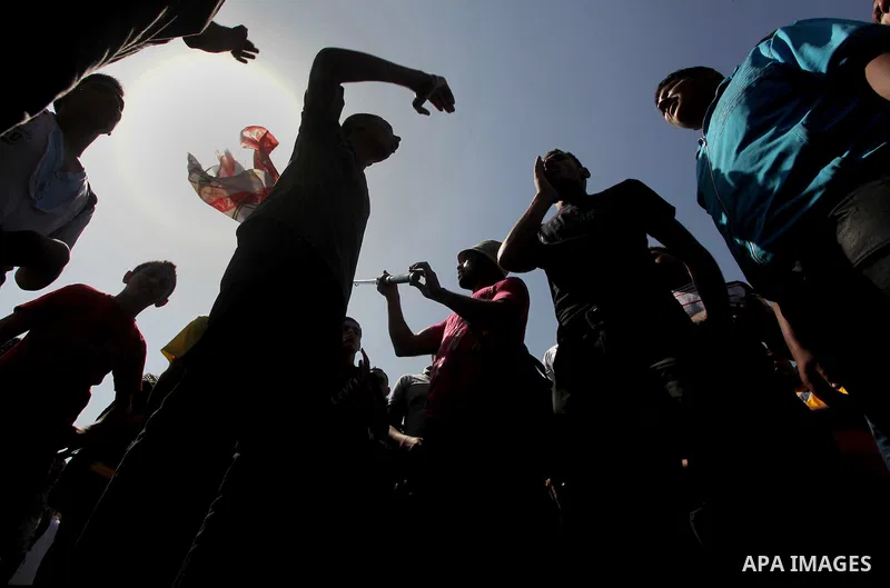 Egyptian protesters march back to the Ministry of Defense after battling thugs in the nearby streets of the Abasseya neighborhood of Cairo for several hours on Sunday, April 29, 2012. The army had mover back their securi...