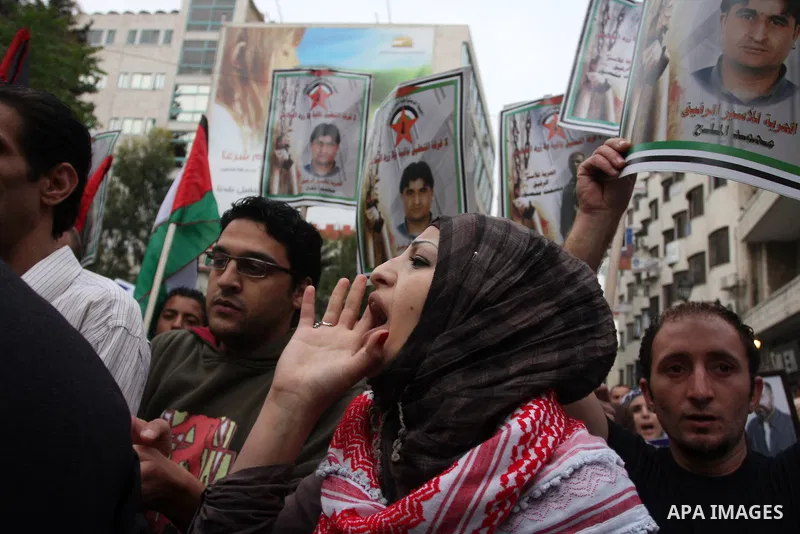 A Palestinian girl chant slogans during a protest to call for the release of Palestinian prisoners held in Israeli jails in the West Bank village of Nabi Saleh near Ramallah, on April 27, 2012. Photo by Issam Rimawi