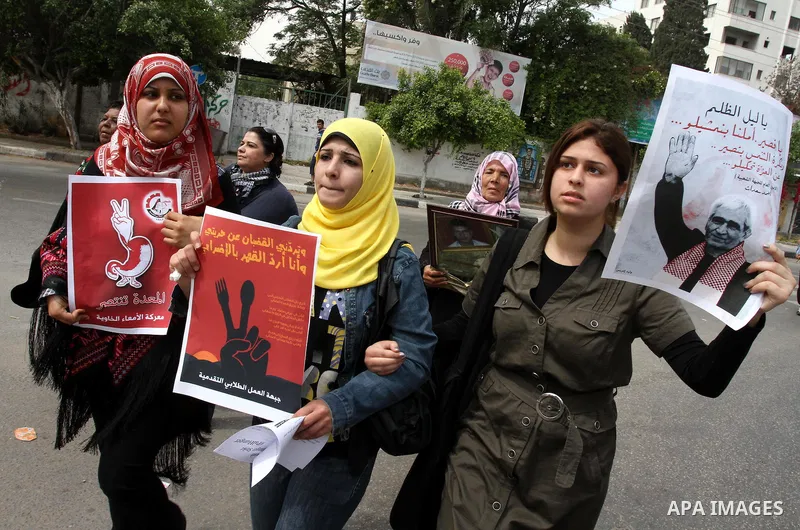 Palestinian women shout slogans during a demonstration for the release of Palestinian prisoners held in Israeli jails in Gaza City on April 30, 2012. At least 1,350 Palestinian prisoners being held in Israel are observin...