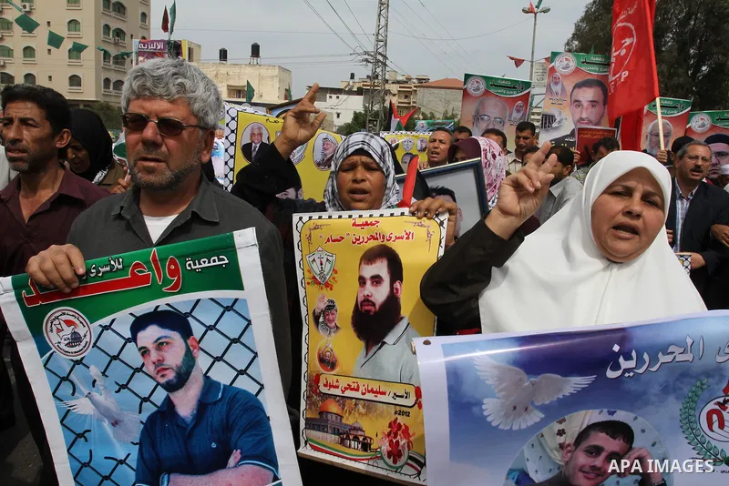 Palestinians shout slogans during a demonstration for the release of Palestinian prisoners held in Israeli jails in Gaza City on April 30, 2012. At least 1,350 Palestinian prisoners being held in Israel are observing an...