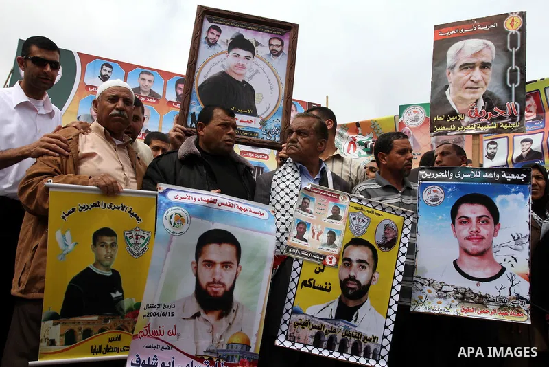 Palestinians shout slogans during a demonstration for the release of Palestinian prisoners held in Israeli jails in Gaza City on April 30, 2012. At least 1,350 Palestinian prisoners being held in Israel are observing an...