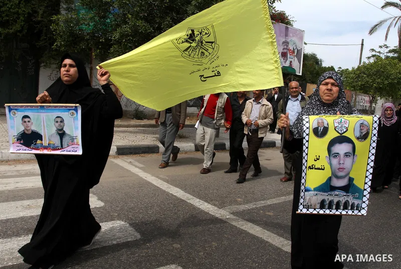 Palestinians shout slogans during a demonstration for the release of Palestinian prisoners held in Israeli jails in Gaza City on April 30, 2012. At least 1,350 Palestinian prisoners being held in Israel are observing an...