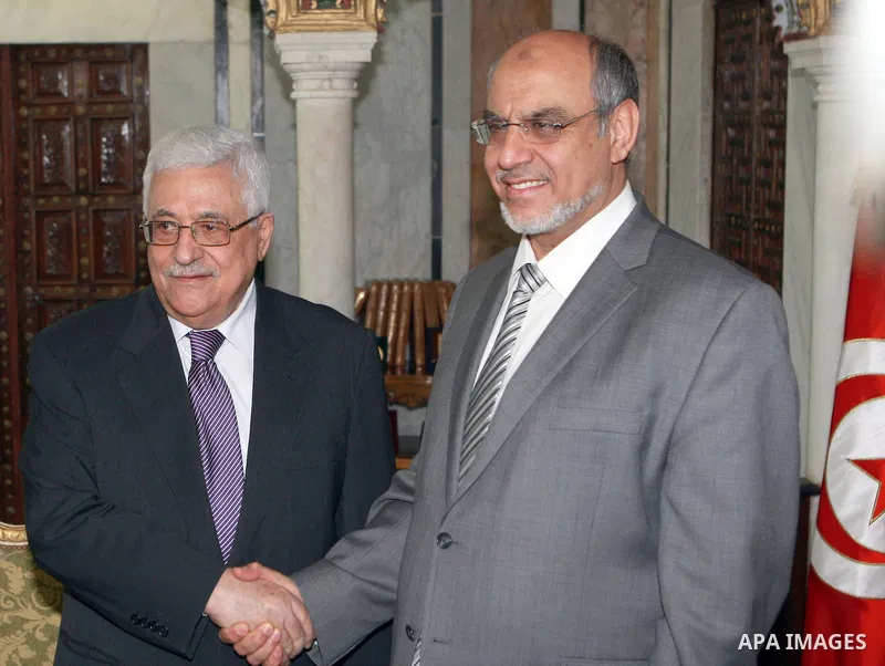 Palestinian president Mahmoud Abbas shakes hands with Tunisia's Prime Minister, Hamadi Jebali (R), in Tunisia, on April 30, 2012. Palestinian President Mahmud Abbas arrived in Tunisia on April 28 for a three-day official...
