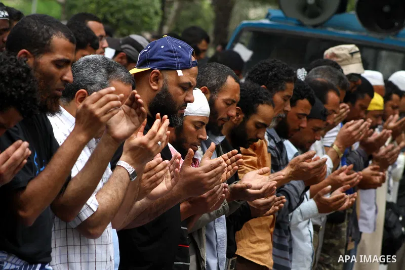 Egyptian Protesters pray near the Ministry of Defense in the Abbassiya district of Cairo April 30, 2012. Protesters continued their sit-in on April 30 after they were attacked two days earlier, which resulted in the deat...