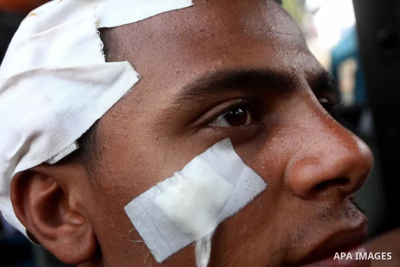 Egyptian man injured in clashes between protesters and military near the Ministry of Defense in the Abbassiya district of Cairo April 30, 2012. Protesters continued their sit-in on April 30 after they were attacked two d...
