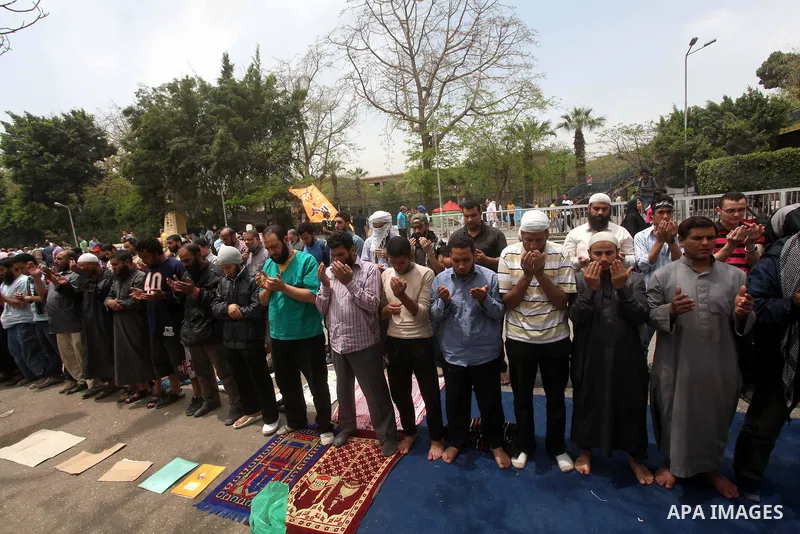 Egyptian Protesters pray near the Ministry of Defense in the Abbassiya district of Cairo April 30, 2012. Protesters continued their sit-in on April 30 after they were attacked two days earlier, which resulted in the deat...