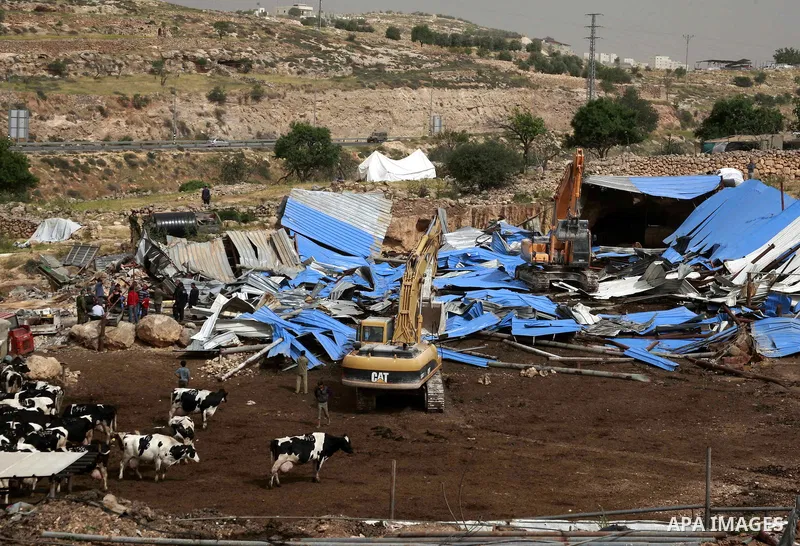 Israeli soldiers destroy a Palestinian farm to cows in the West Bank city of Hebron, May. 01, 2012. Reports state that tensions rose as Palestinian homes were destroyed by Israeli authorities for allegedly not having a b...