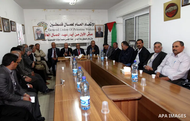 Palestinian prime minister Salam Fayyad participates a meeting " International Workers' Day" at the headquarters of the General Union of Palestine Workers, in the West Bank City of Ramallah, on May 01, 2012. Photo by Mus...