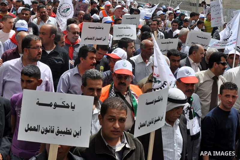 Palestinian workers shouting and calling Palestinian government to improve conditions of workers and create jobs during a protest in the West Bank city of Nablus on May 01,2012. Photo by Nedal shtieh