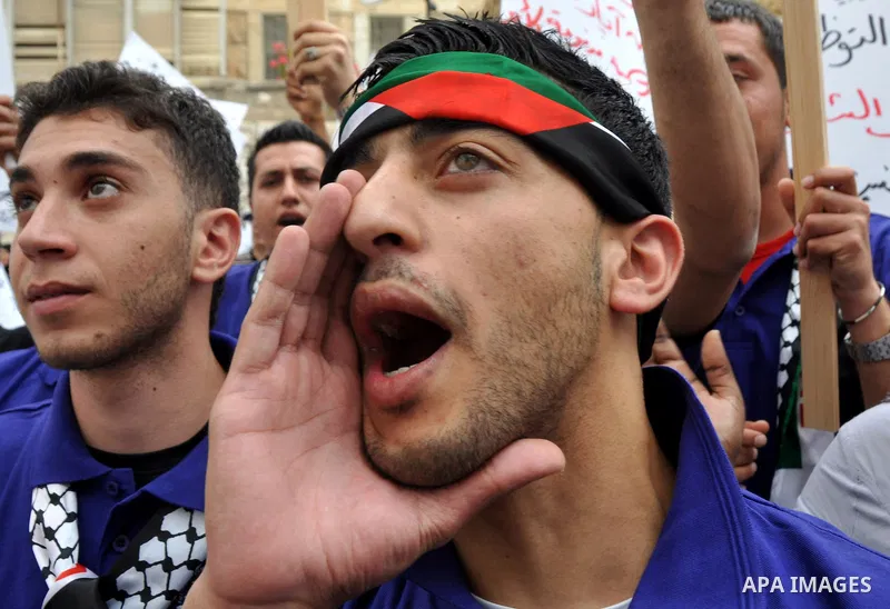 Palestinian workers shouting and calling Palestinian government to improve conditions of workers and create jobs during a protest in the West Bank city of Nablus on May 01,2012. Photo by Nedal shtieh