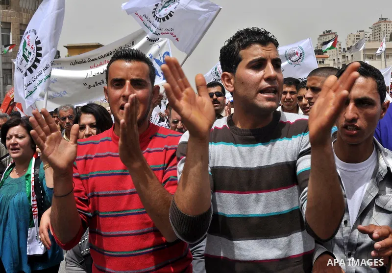 Palestinian workers shouting and calling Palestinian government to improve conditions of workers and create jobs during a protest in the West Bank city of Nablus on May 01,2012. Photo by Nedal shtieh