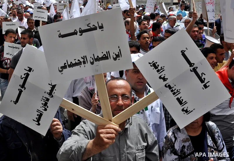 Palestinian workers shouting and calling Palestinian government to improve conditions of workers and create jobs during a protest in the West Bank city of Nablus on May 01,2012. Photo by Nedal shtieh