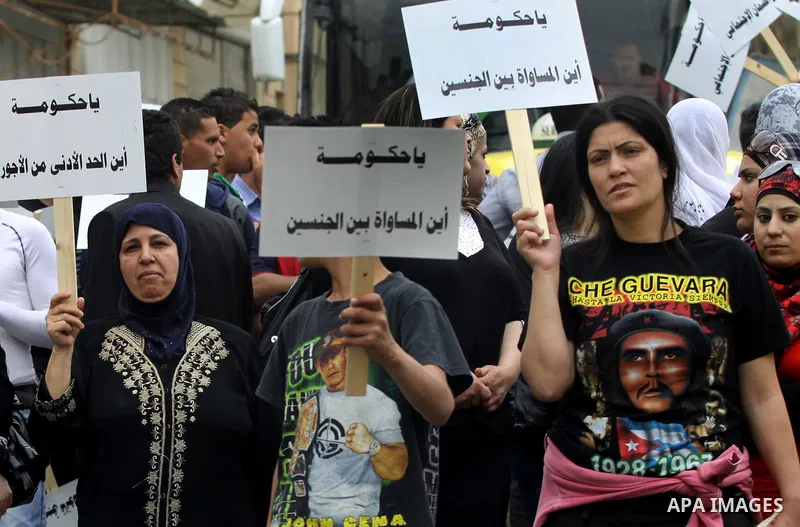 Palestinian workers shouting and calling Palestinian government to improve conditions of workers and create jobs during a protest in the West Bank city of Nablus on May 01,2012. Photo by Nedal shtieh