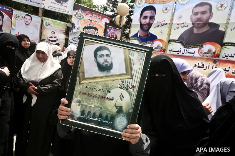 Palestinians attend a rally to show solidarity with Palestinians prisoners held in Israeli jails, in Gaza City, May 01, 2012. Human rights groups say up to 2,000 prisoners have joined an open-ended hunger strike to prote...