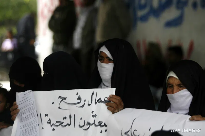 Palestinian women participate a protest to mark "workers' Day" in Rafah town In Gaza Strip, on May 01, 2012. Photo by Eyad Al Baba