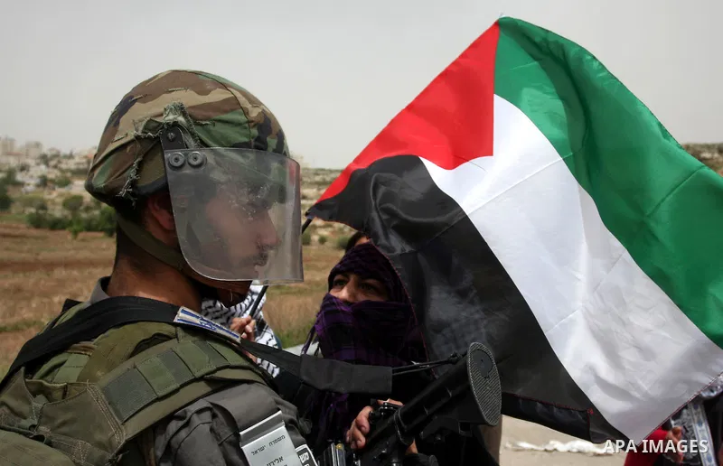 Palestinian woman shouts slogans against Israeli troops outside Ofer military prison near the West Bank city of Ramallah on May 1, 2012 during a demonstration in support for prisoners held in Israeli jails. Clashes erupt...