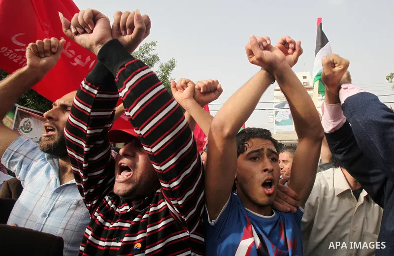 Palestinians shout slogans during a demonstration in "Worker's Day" in Gaza city, against israel's economic blockade of the Gaza Strip was imposed after the militant Hamas group violently seized power in the territory Fi...