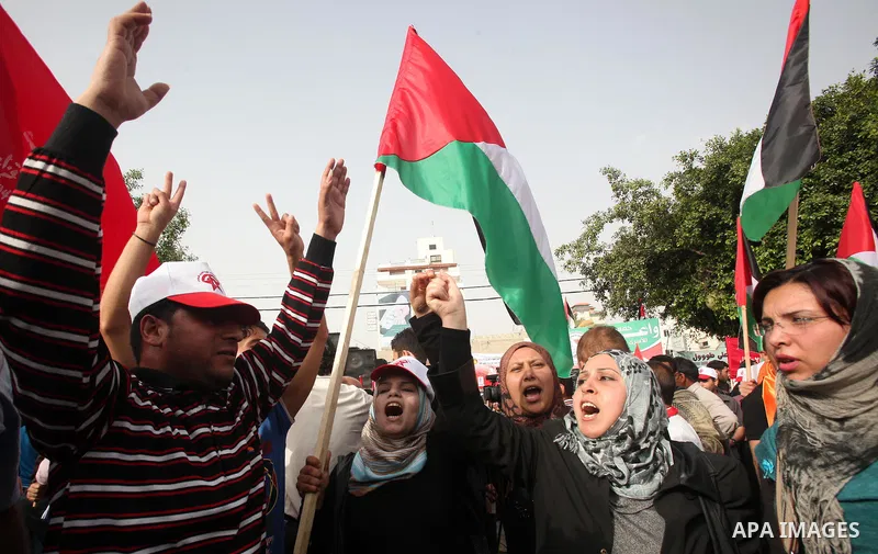 Palestinians shout slogans during a demonstration in "Worker's Day" in Gaza city, against israel's economic blockade of the Gaza Strip was imposed after the militant Hamas group violently seized power in the territory Fi...