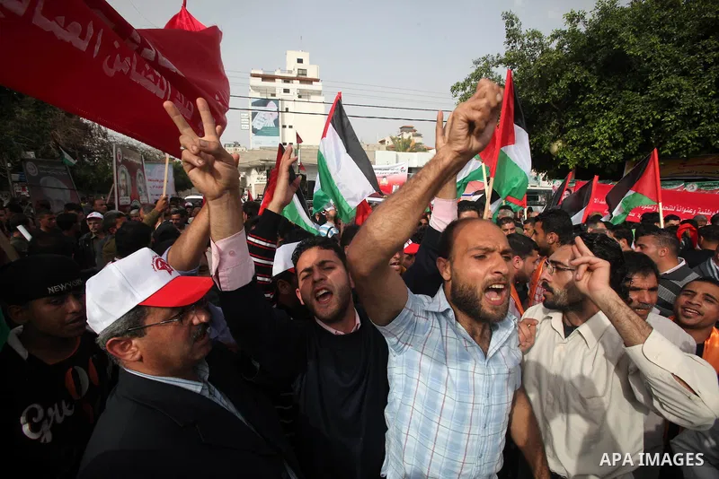 Palestinians shout slogans during a demonstration in "Worker's Day" in Gaza city, against israel's economic blockade of the Gaza Strip was imposed after the militant Hamas group violently seized power in the territory Fi...