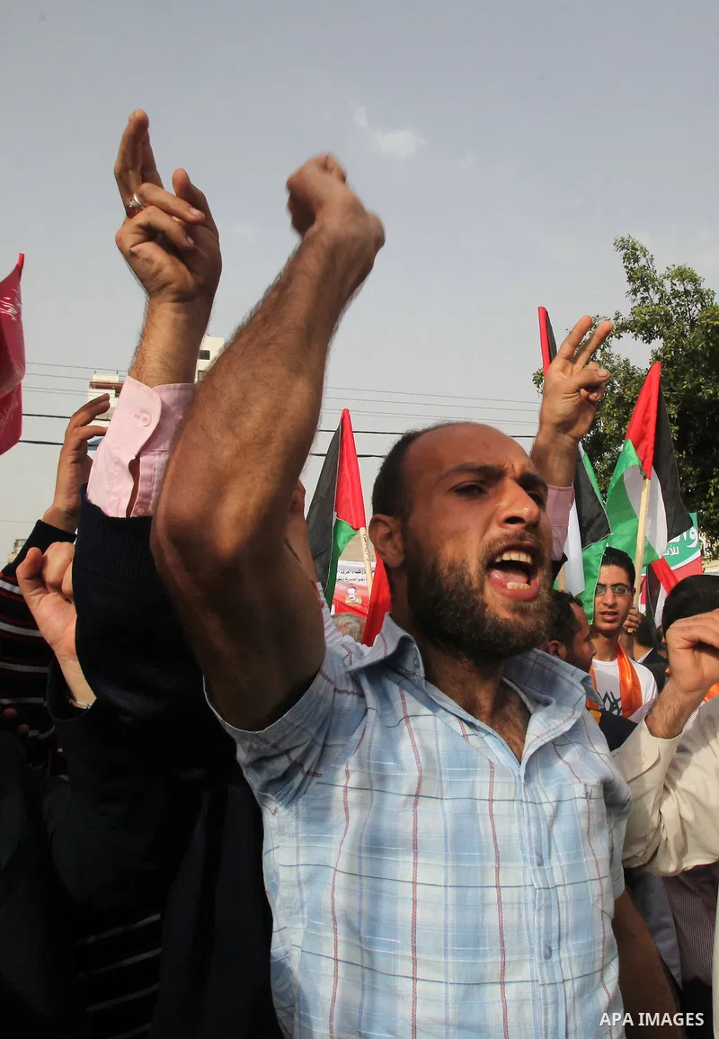 Palestinians shout slogans during a demonstration in "Worker's Day" in Gaza city, against israel's economic blockade of the Gaza Strip was imposed after the militant Hamas group violently seized power in the territory Fi...