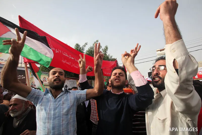 Palestinians shout slogans during a demonstration in "Worker's Day" in Gaza city, against israel's economic blockade of the Gaza Strip was imposed after the militant Hamas group violently seized power in the territory Fi...