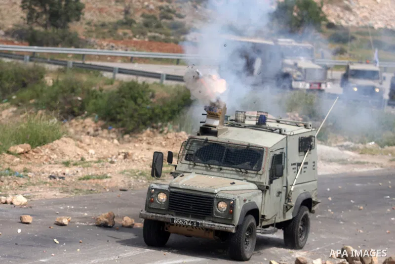 Israeli troops fired tear gas fired near Palestinian stone-throwers during clashes next to the Israeli military prison of Ofer, near Beitunia, West Bank, 02 May 2012. The protesters were protesting in solidarity with the...
