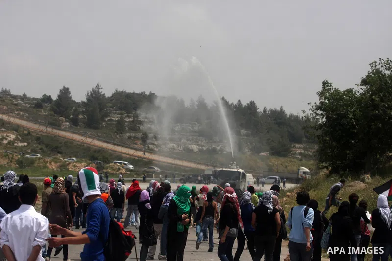 Palestinians throw stones at Israeli soldiers during clashes next to the Israeli military prison of Ofer, near Beitunia, West Bank, 02 May 2012. The protesters were protesting in solidarity with the Palestinian prisoners...