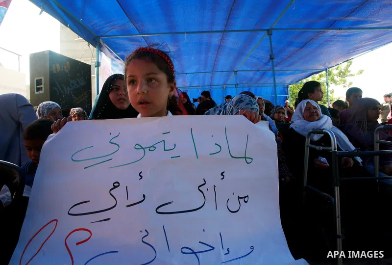 Palestinian Children of Al-Samuni family, protests against the Israeli military has decided on Tuesday, May 1, 2012 not to file any charges in one of the gravest incidents in its 2009 war in the Gaza Strip, closing its i...