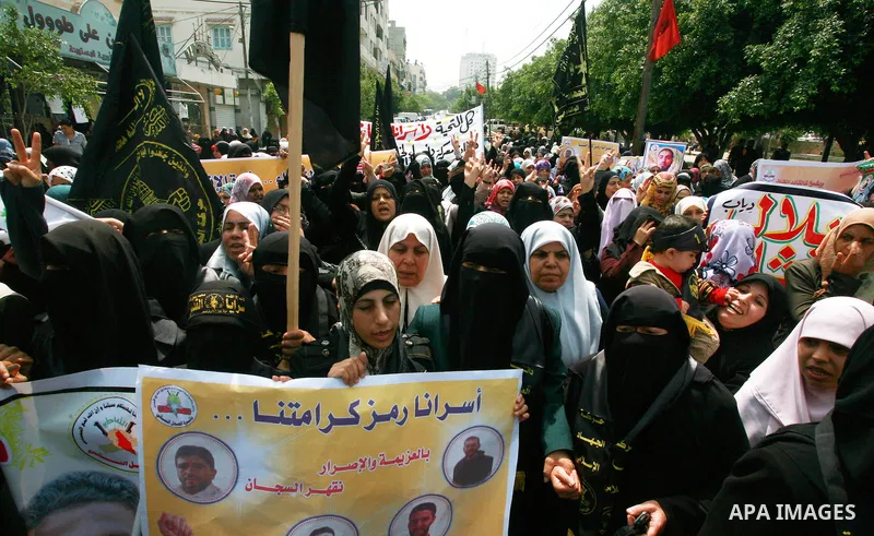 Palestinian women chant slogans during a rally in Gaza City in support of more than a thousand prisoners who are on an open-ended hunger strike in Israeli jails on May 3, 2012. At least 1,550 Palestinians in Israeli jail...