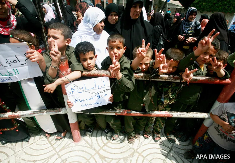 Palestinian women and Children chant slogans during a rally in Gaza City in support of more than a thousand prisoners who are on an open-ended hunger strike in Israeli jails on May 3, 2012. At least 1,550 Palestinians in...