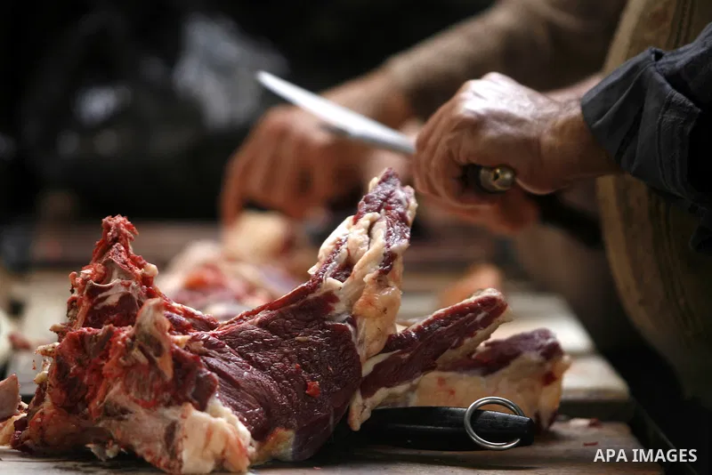 Palestinian butchers slaughter cows in his shop in Rafah, southern Gaza Strip, May 03, 2012. A U.N. agency said Wednesday May 2, 2012 that Egypt's outbreak of foot-and-mouth disease has reached neighboring Gaza Strip and...