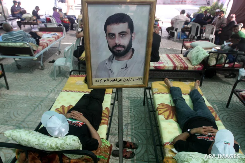 Palestinians participat at hunger striking during a sit-in tent held by Palestinian released prisoners, solidarity with Palestinian prisoners held in Israeli jails, in Gaza City on May 3, 2012. Over the past week, Over t...