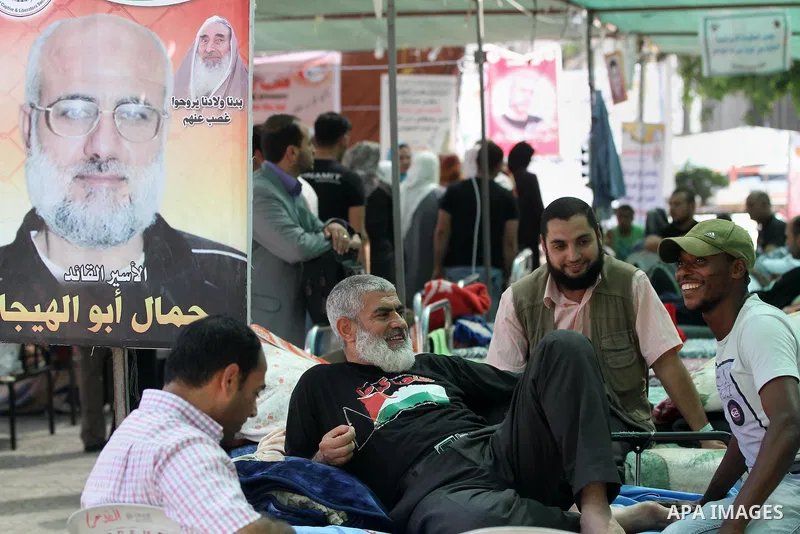 Palestinians participat at hunger striking during a sit-in tent held by Palestinian released prisoners, solidarity with Palestinian prisoners held in Israeli jails, in Gaza City on May 3, 2012. Over the past week, Over t...