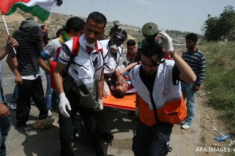 Palestinians demonstrator injured during clashes next to the Israeli military prison of Ofer, near Beitunia, West Bank, 02 May 2012. following a demonstration in solidarity with Palestinian prisoners held in Israeli jail...