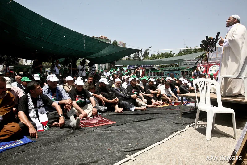 Palestinian Prime Minister in Gaza Ismail Haniyeh during the friday prayers at a sit-in tent held by Palestinian released prisoners, solidarity with Palestinian prisoners held in Israeli jails, in Gaza City on May 04, 20...