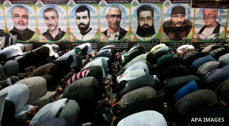 Palestinian Prime Minister in Gaza Ismail Haniyeh (not seen) during the friday prayers at a sit-in tent held by Palestinian released prisoners, solidarity with Palestinian prisoners held in Israeli jails, in Gaza City on...