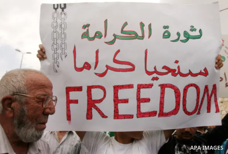 Palestinian protesters hold up banners and portraits of a prisoners jailed in Israel, during a Sit-in held in old City of Jerusalem, May 04, 2012. Over the past week, over 1400 Palestinian prisoners have begun an open-en...