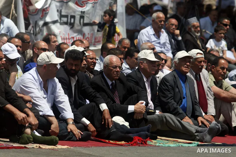 Palestinians perform Friday prayers during protest, in Ramallah, West Bank, May 04, 2012. An estimated 2,000 Palestinians held in prayer outside a tent in solidarity with prisoners who have been waging a hunger strike in...