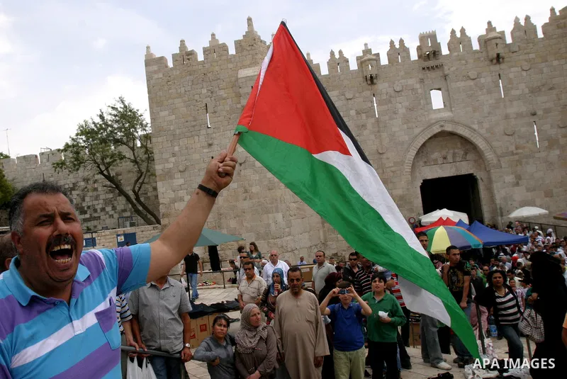 Palestinian protesters hold up banners and portraits of a prisoners jailed in Israel, during a Sit-in held in old City of Jerusalem, May 04, 2012. Over the past week, over 1400 Palestinian prisoners have begun an open-en...