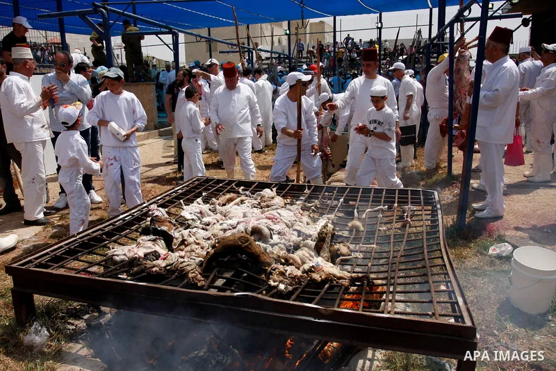 Members of the Samaritan sect prepare a traditional oven with mud during the traditional Passover sacrifice in Mount Gerizim, in the northern West Bank city of Nablus, 04 May 2012. According to tradition, the Samaritans...